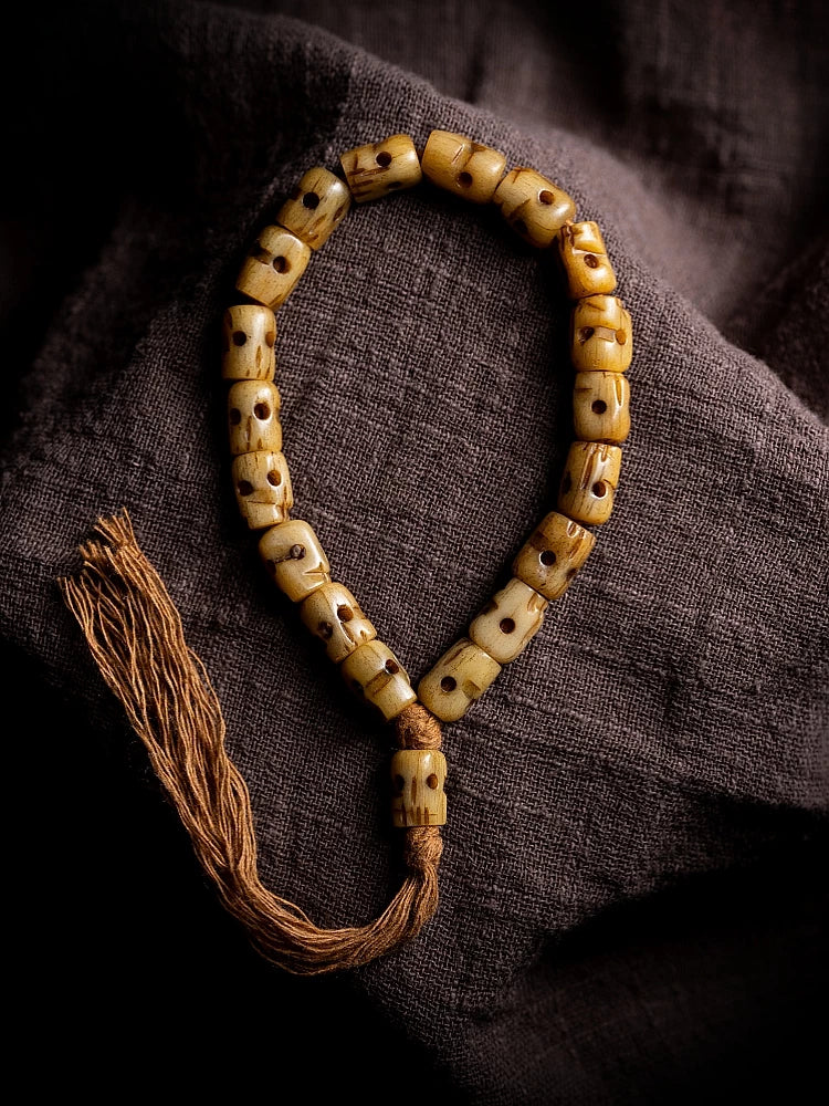 Hand Carved Citipati Skull Beaded Mala Bracelet With Tassel Natural Aged Yak Bone Vintage Tibetan Buddhist Prayer Beads Wrist Mala Authentic Handcrafted Protection Amulet Bracelet