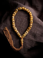 Hand Carved Citipati Skull Beaded Mala Bracelet With Tassel Natural Aged Yak Bone Vintage Tibetan Buddhist Prayer Beads Wrist Mala Authentic Handcrafted Protection Amulet Bracelet