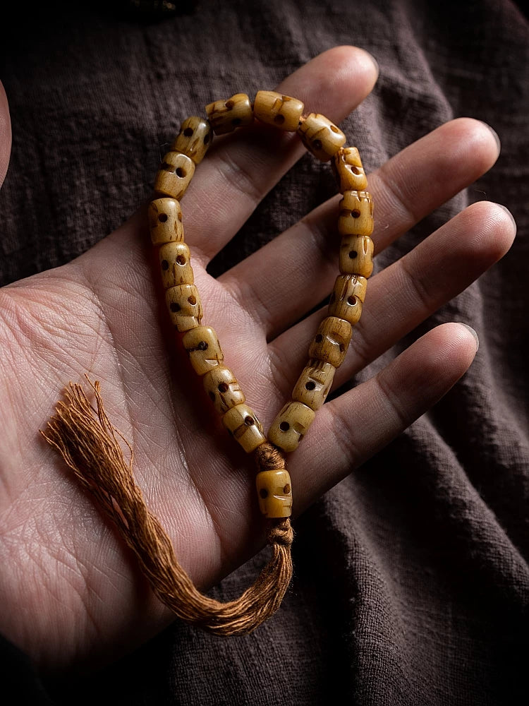 Hand Carved Citipati Skull Beaded Mala Bracelet With Tassel Natural Aged Yak Bone Vintage Tibetan Buddhist Prayer Beads Wrist Mala Authentic Handcrafted Protection Amulet Bracelet