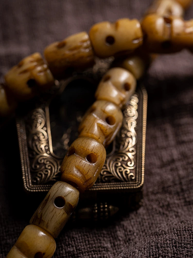 Hand Carved Citipati Skull Beaded Mala Bracelet With Tassel Natural Aged Yak Bone Vintage Tibetan Buddhist Prayer Beads Wrist Mala Authentic Handcrafted Protection Amulet Bracelet