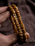 Hand Carved Citipati Skull Beaded Mala Bracelet With Tassel Natural Aged Yak Bone Vintage Tibetan Buddhist Prayer Beads Wrist Mala Authentic Handcrafted Protection Amulet Bracelet