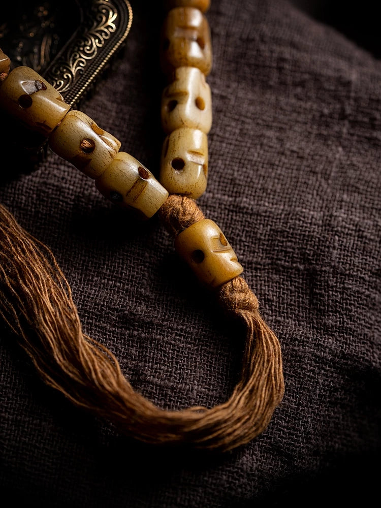 Hand Carved Citipati Skull Beaded Mala Bracelet With Tassel Natural Aged Yak Bone Vintage Tibetan Buddhist Prayer Beads Wrist Mala Authentic Handcrafted Protection Amulet Bracelet